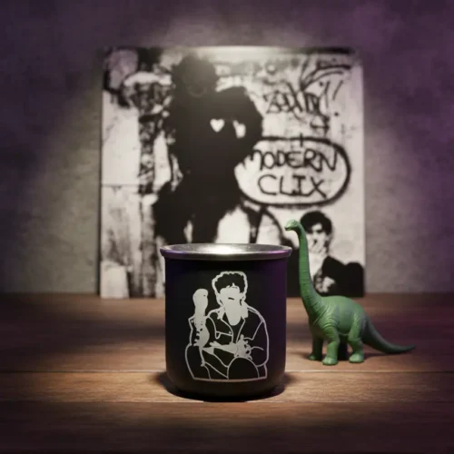 Mate termico grabado laser personalizado negro Soraire Design Charly Garcia Clics Modernos Dinosaurios Frente